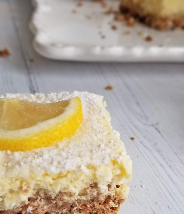 lemon bar close up with crumbs