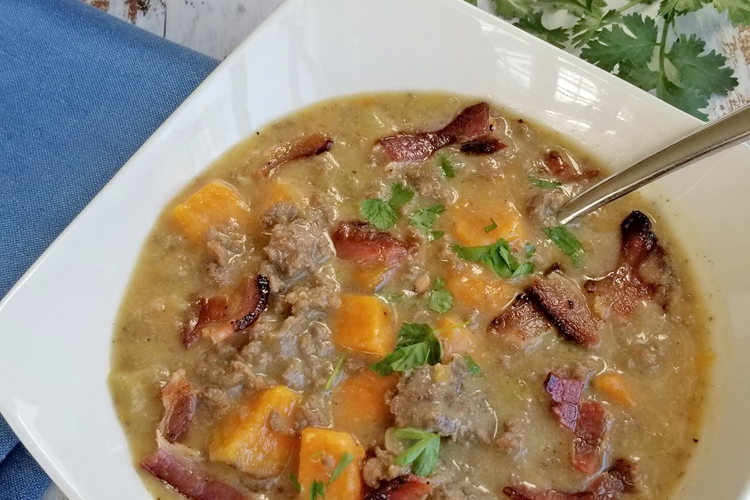 bacon cheeseburger soup one bowl with spoon close up