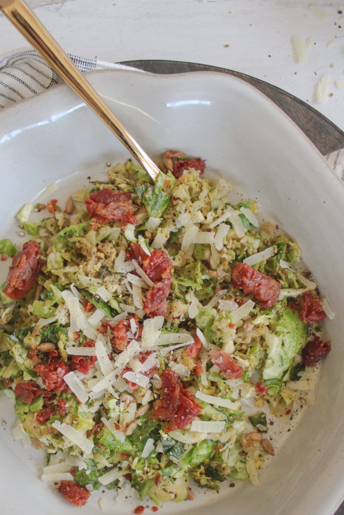 overhead shot of brussels sprouts salad with fork