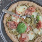 healthy homemade pizza with spoon of leek confit