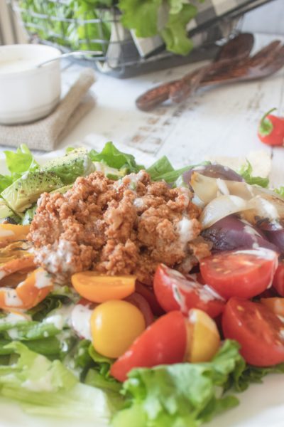 close up of tomatoes and meat in salad