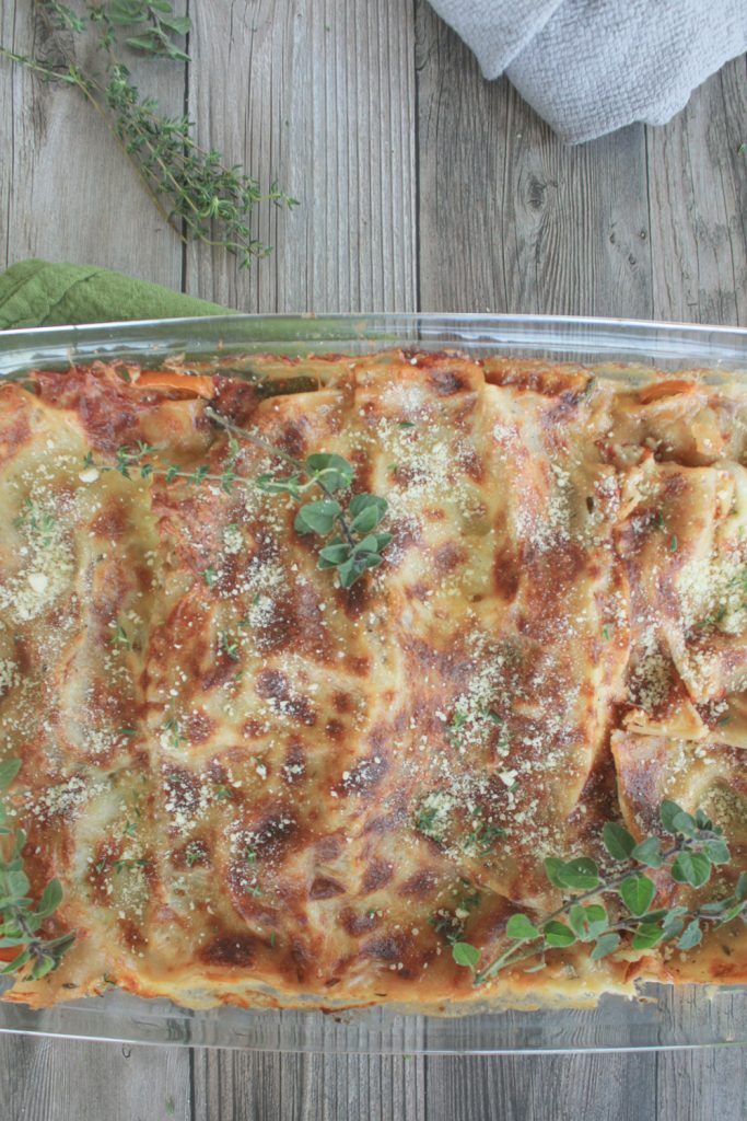 vegetable lasagna in white sauce with herbs