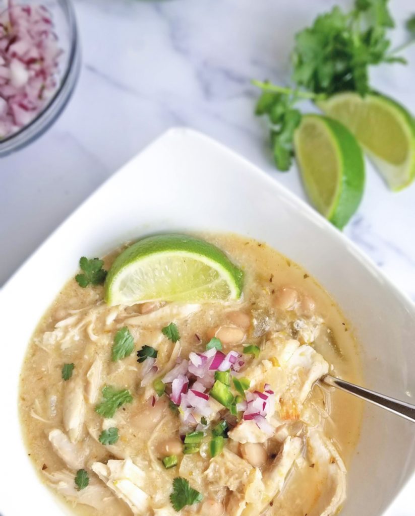 white chicken chili with lime in bowl